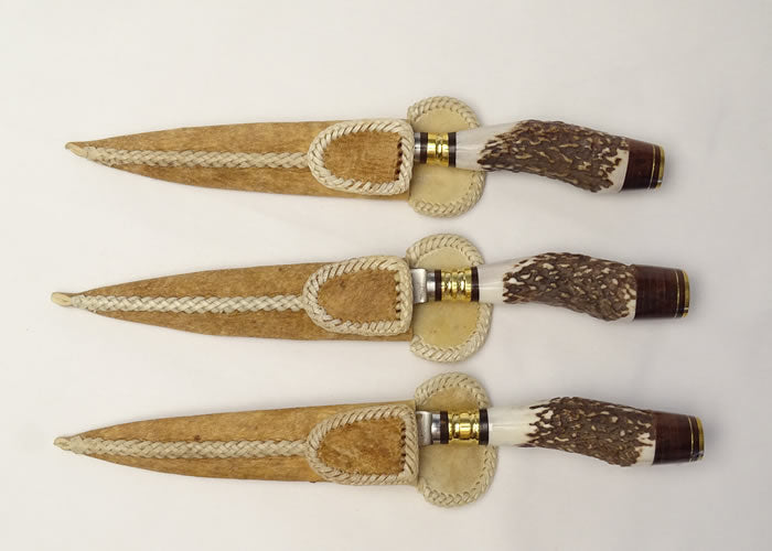 Deer Stag horn knife with bronze detail and rawhide case 5.5 inch / 14 cm.