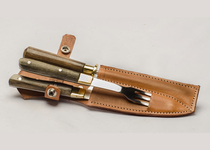 Knife, fork and honing steel set with wooden handle.