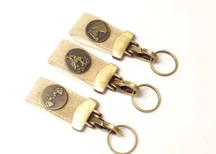 Rawhide key ring with applique.
