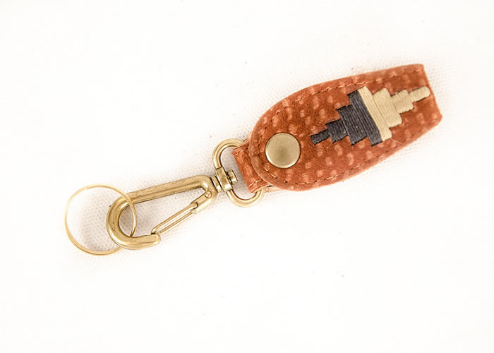 Embroidered capybara leather key ring.