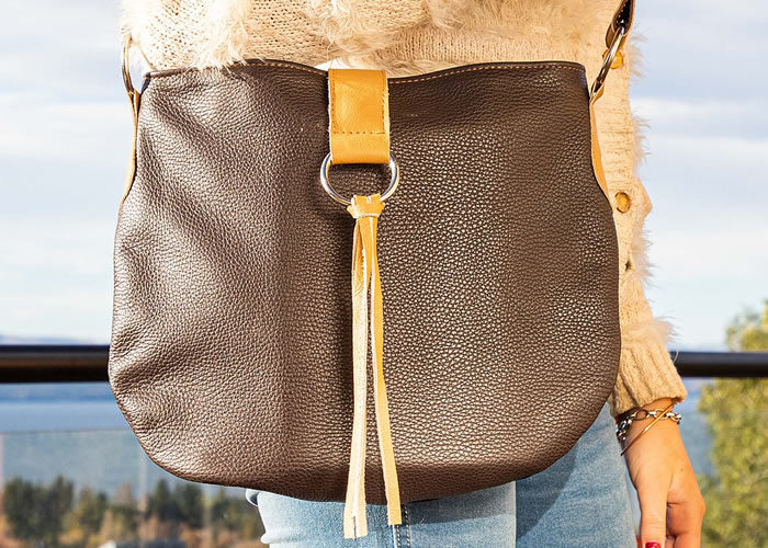 Brown leather handbag with fringes.