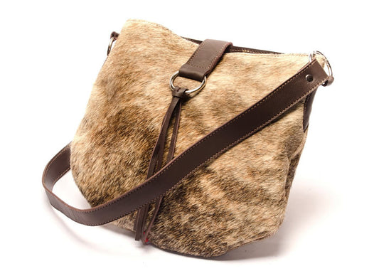 Cowhide leather handbag with fringes.