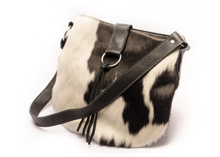 Cowhide leather handbag with fringes.