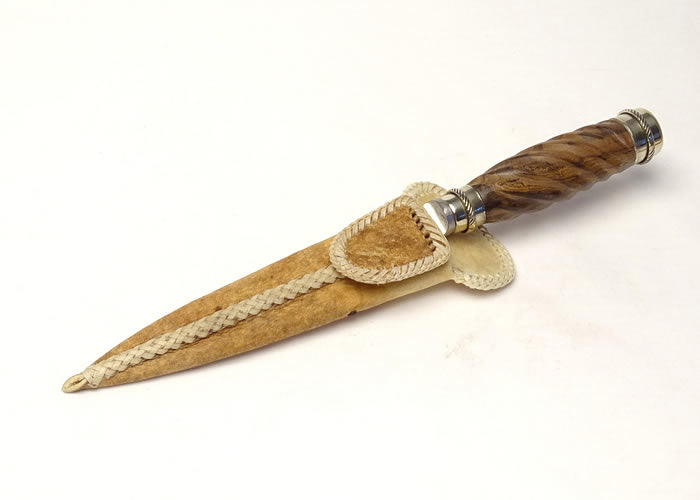 Sculpted knife with Alpaca and rawhide case.