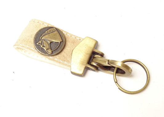 Rawhide key ring with applique.