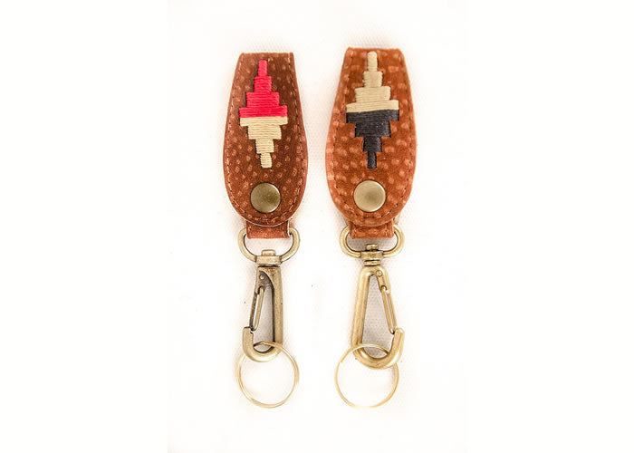 Embroidered capybara leather key ring.