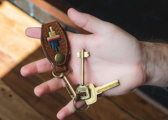 Embroidered leather key ring.