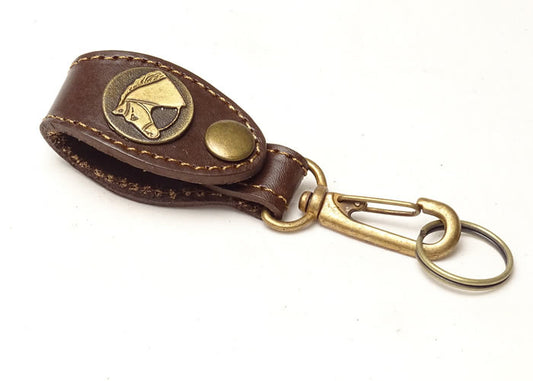 Brown leather key ring with horse applique.